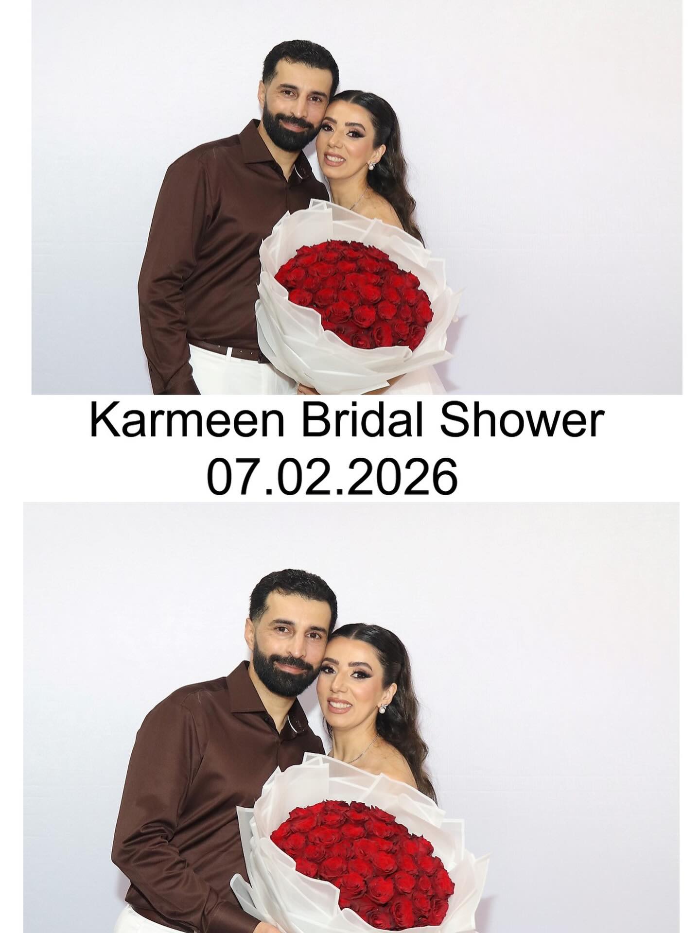 Two friends in matching red tops striking a playful pose in the booth